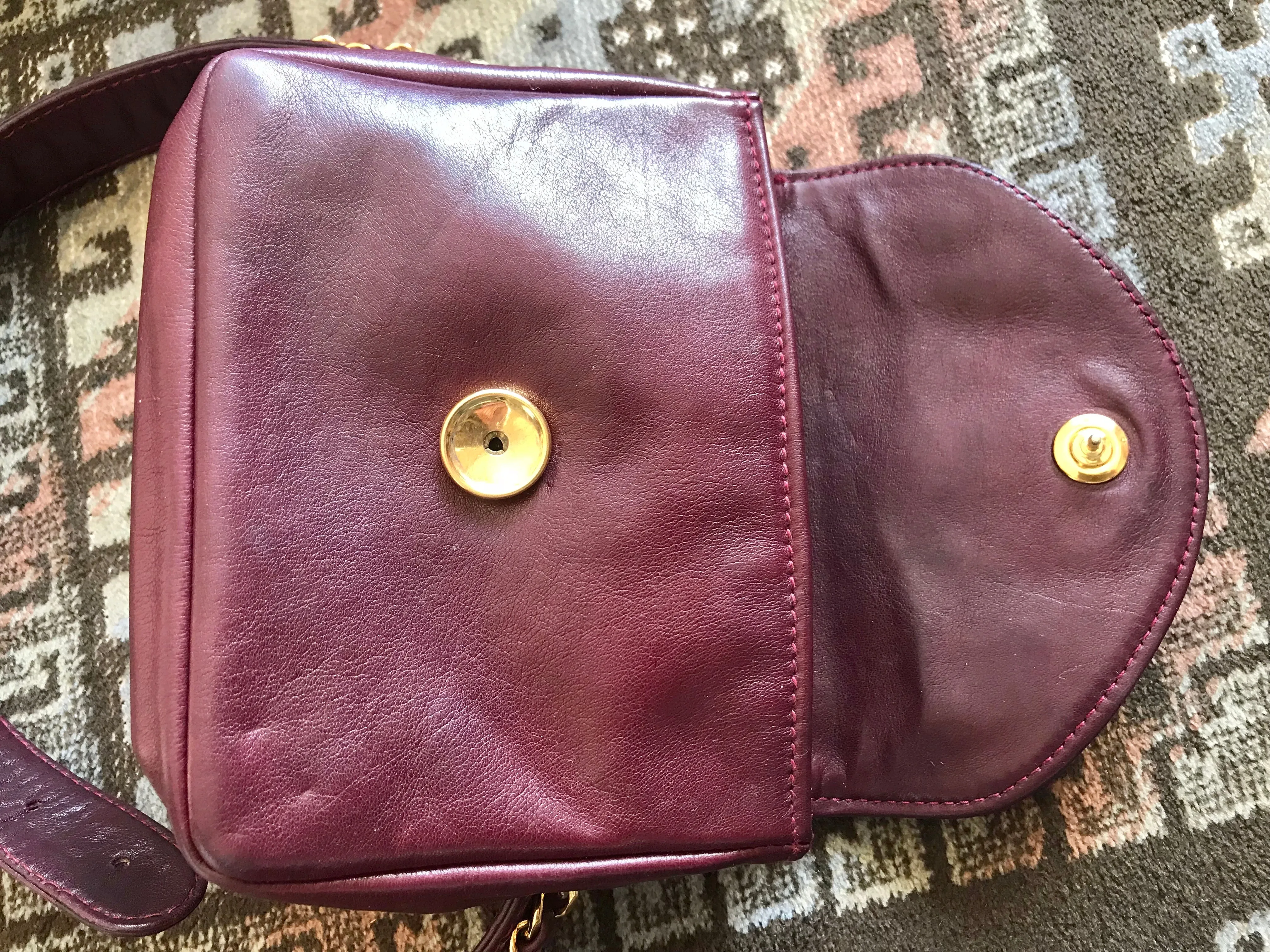 Vintage CHANEL wine fanny pack, leather belt bag with detachable chain belt and CC stitch mark on flap.  Fits 29.5" -32.6"