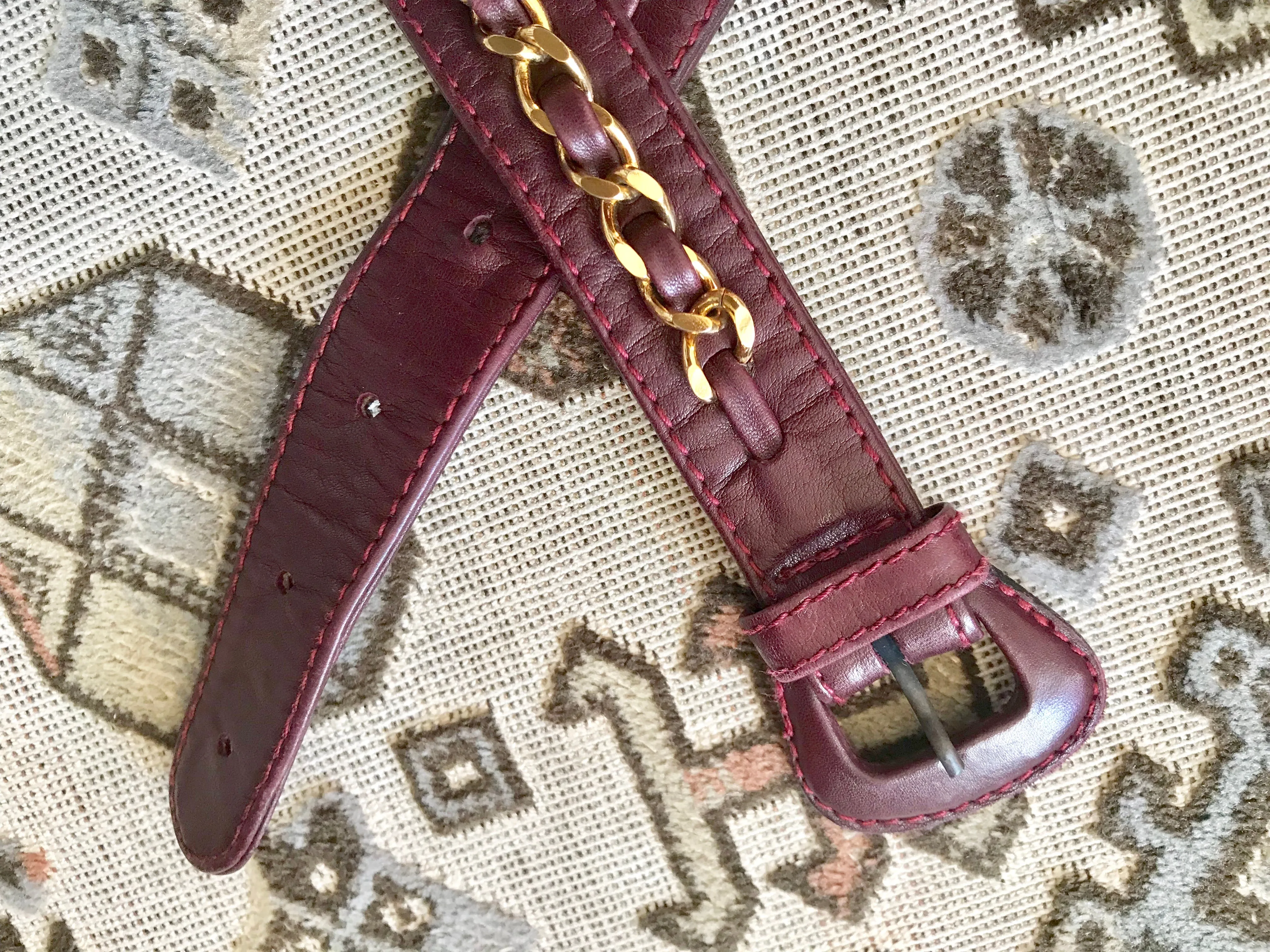Vintage CHANEL wine fanny pack, leather belt bag with detachable chain belt and CC stitch mark on flap.  Fits 29.5" -32.6"