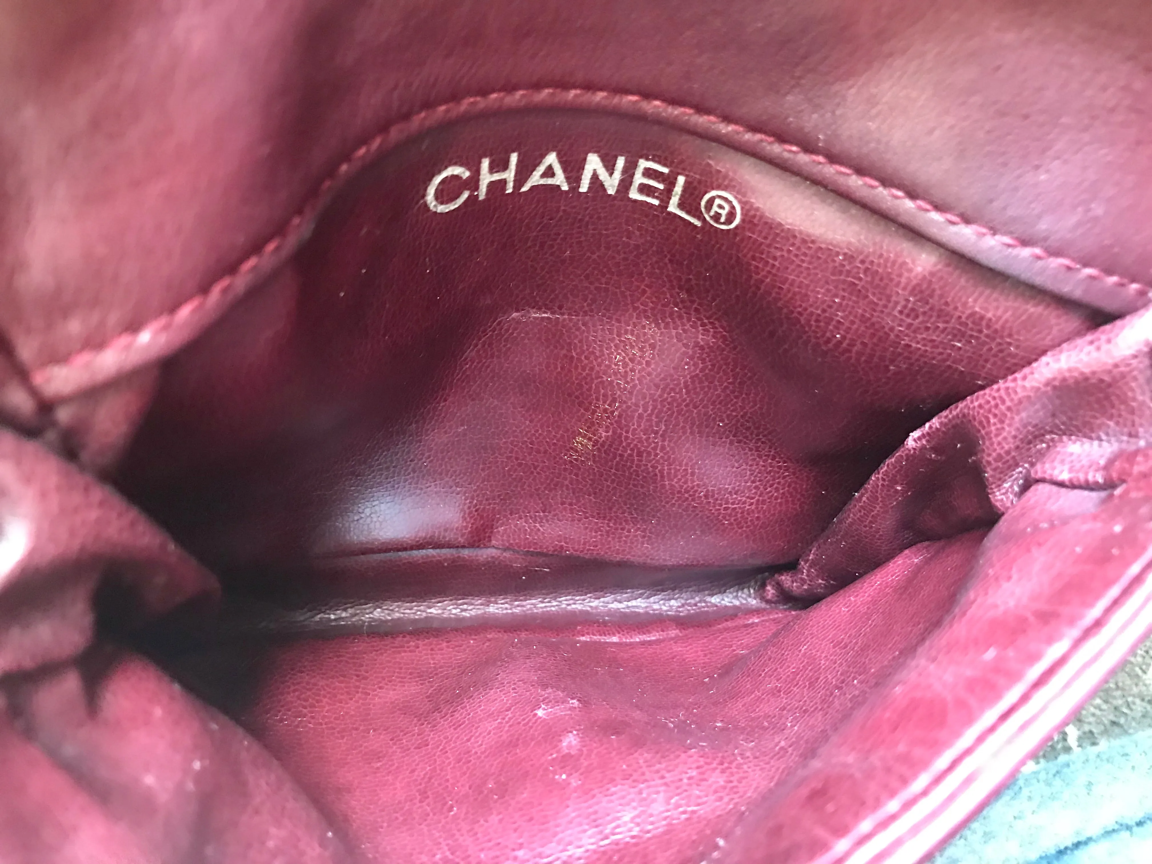 Vintage CHANEL wine fanny pack, leather belt bag with detachable chain belt and CC stitch mark on flap.  Fits 29.5" -32.6"