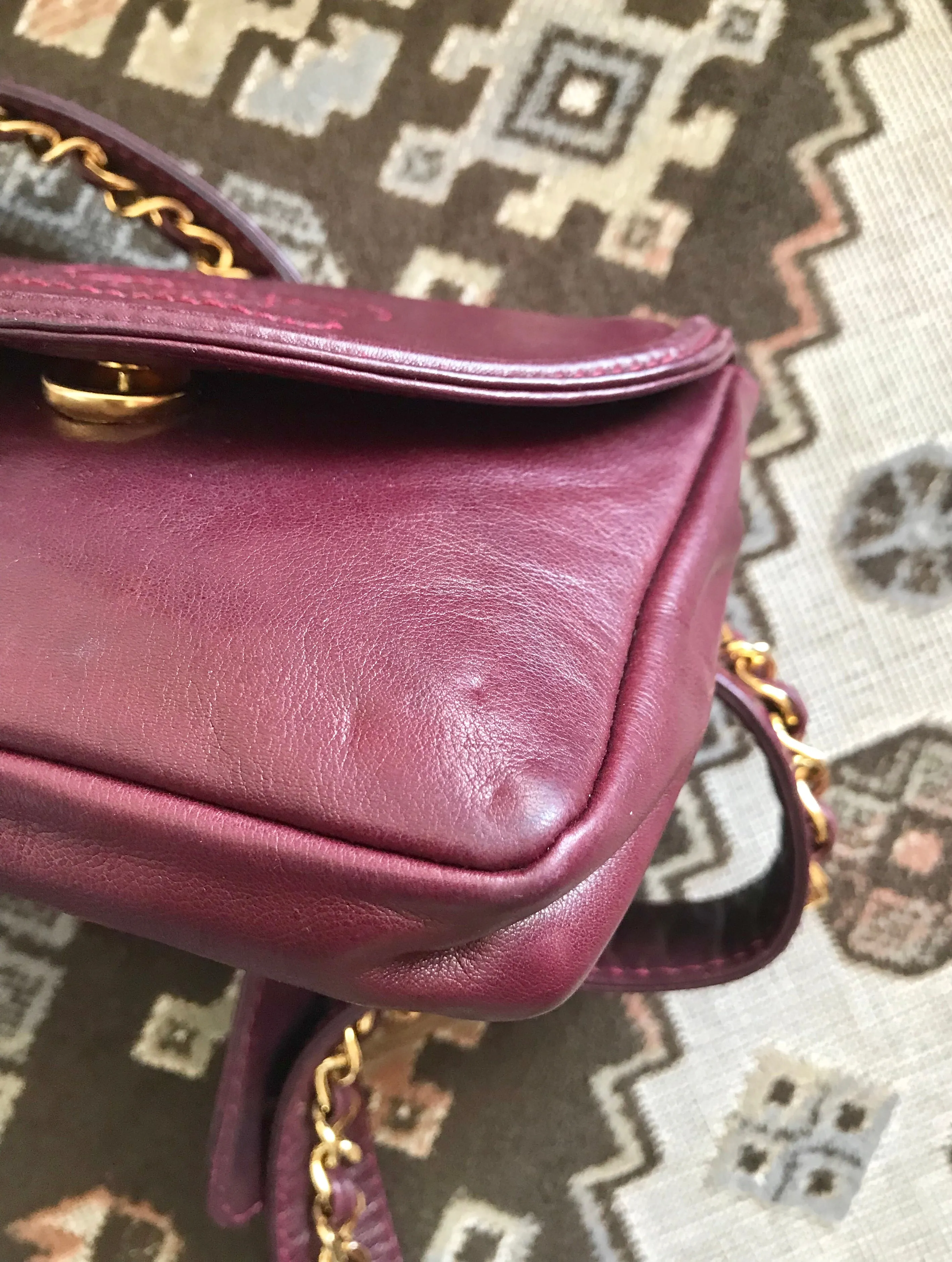 Vintage CHANEL wine fanny pack, leather belt bag with detachable chain belt and CC stitch mark on flap.  Fits 29.5" -32.6"
